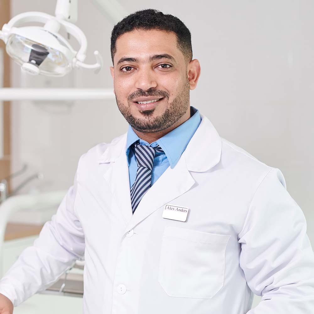 middle-eastern-dentist-posing-by-chair-3WJ4MEV.jpg